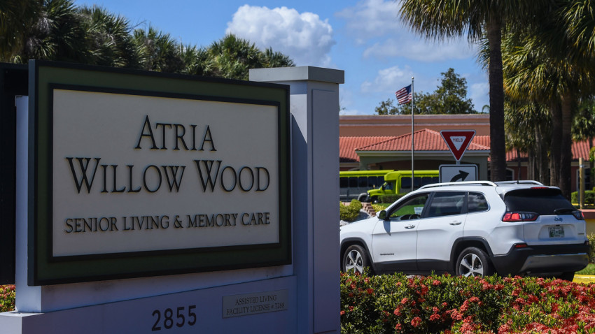 A car enters the Atria Senior Living center where 3 residents with coronavirus,COVID-19, died near Fort Lauderdale, Florida on March 21, 2020. - Almost one billion people were confined to their homes worldwide as the global coronavirus death toll topped 12,000 and US states rolled out stay-at-home measures already imposed across swathes of Europe. More than a third of Americans were adjusting to life in various phases of virtual lockdown -- including in the US's three biggest cities of New York, Los Angeles and Chicago -- with more states expected to ramp up restrictions. (Photo by CHANDAN KHANNA / AFP) (Photo by CHANDAN KHANNA/AFP via Getty Images)