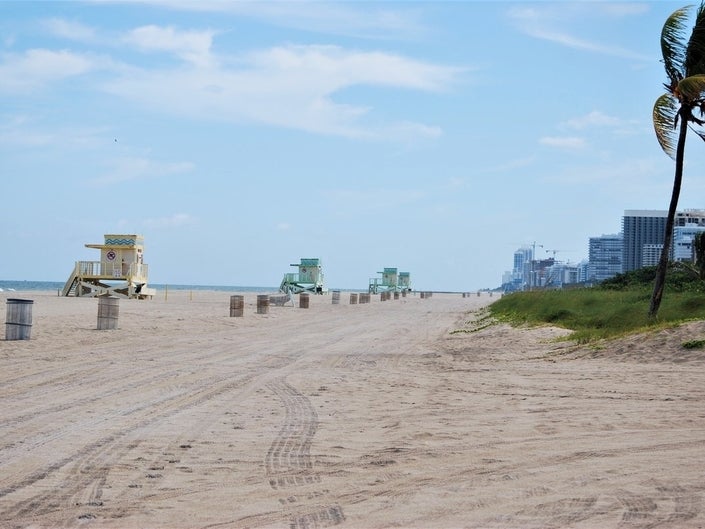 Want to take a walk? Stick to the street. Miami-Dade closes beaches and parks